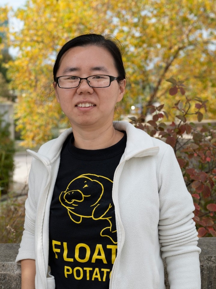 Photo of Dr. Xie taken outside, on the NKU campus, during the biology Olympics event.