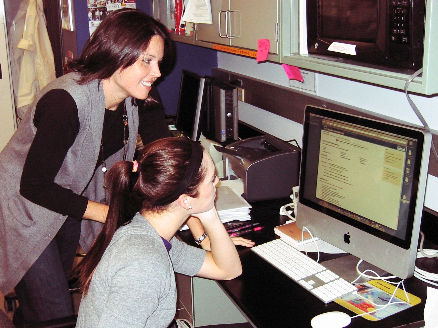 Dr. Bowling and a fellow researcher looking at data on a computer