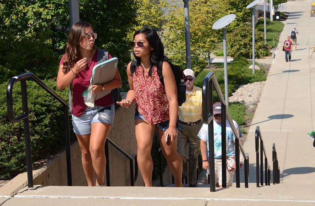 Students walking up stairs on campus