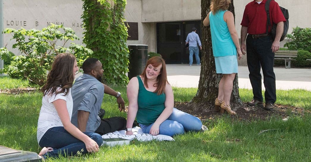 Students gathered outdoors outside Louie B Nunn fall