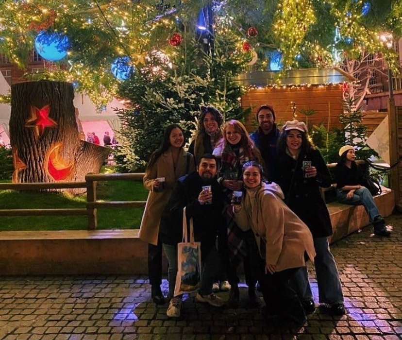 Cassie Rinehard posing with friends outside