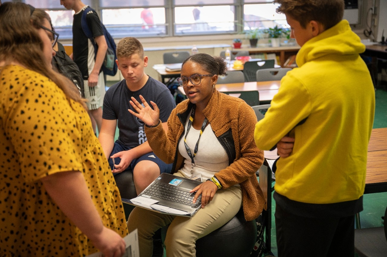 Students gathered around in a group.