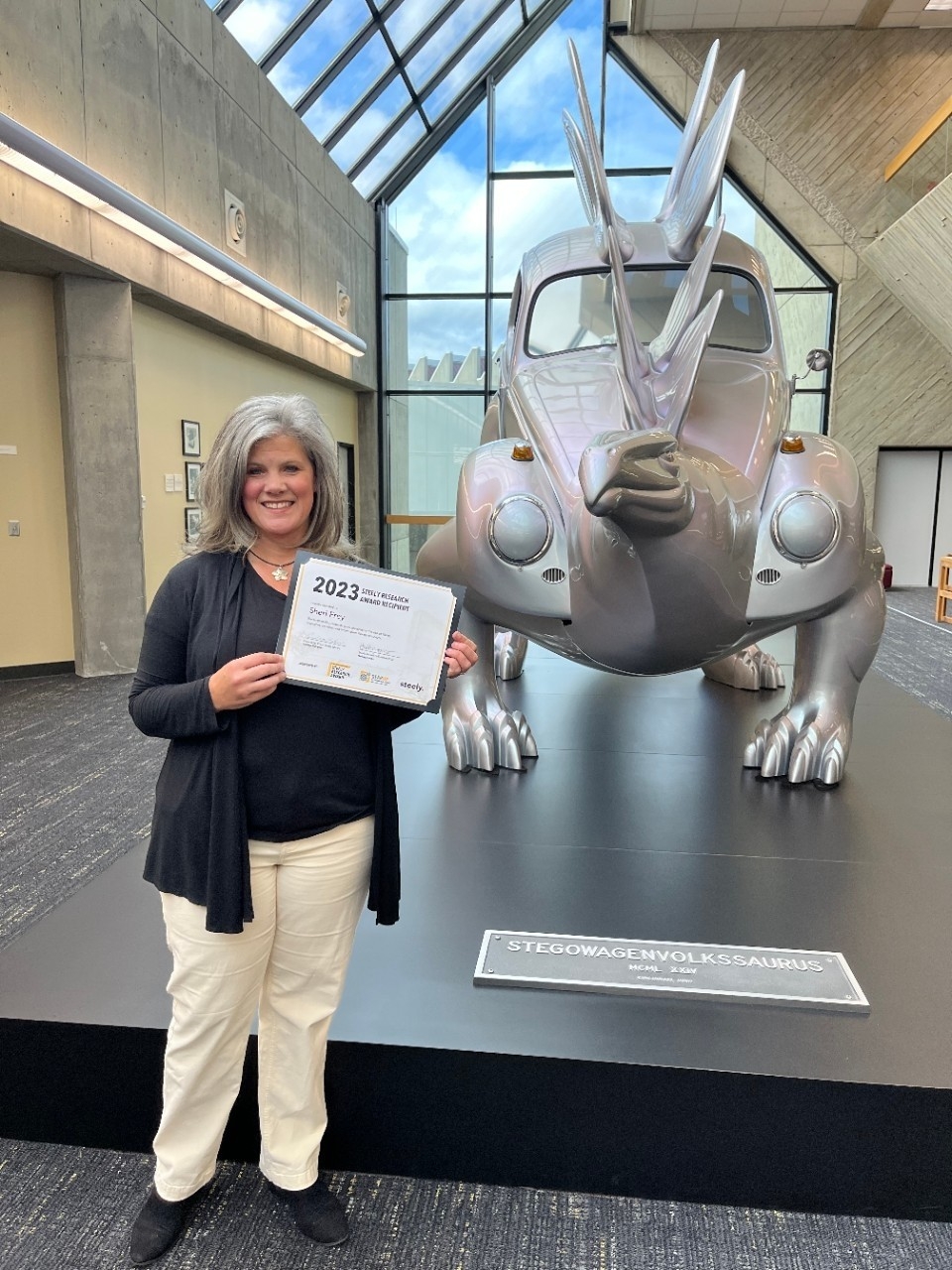 Sheri Frey holding an award