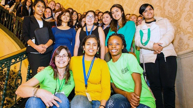 Women in Informatics group photo on a spiral staircase