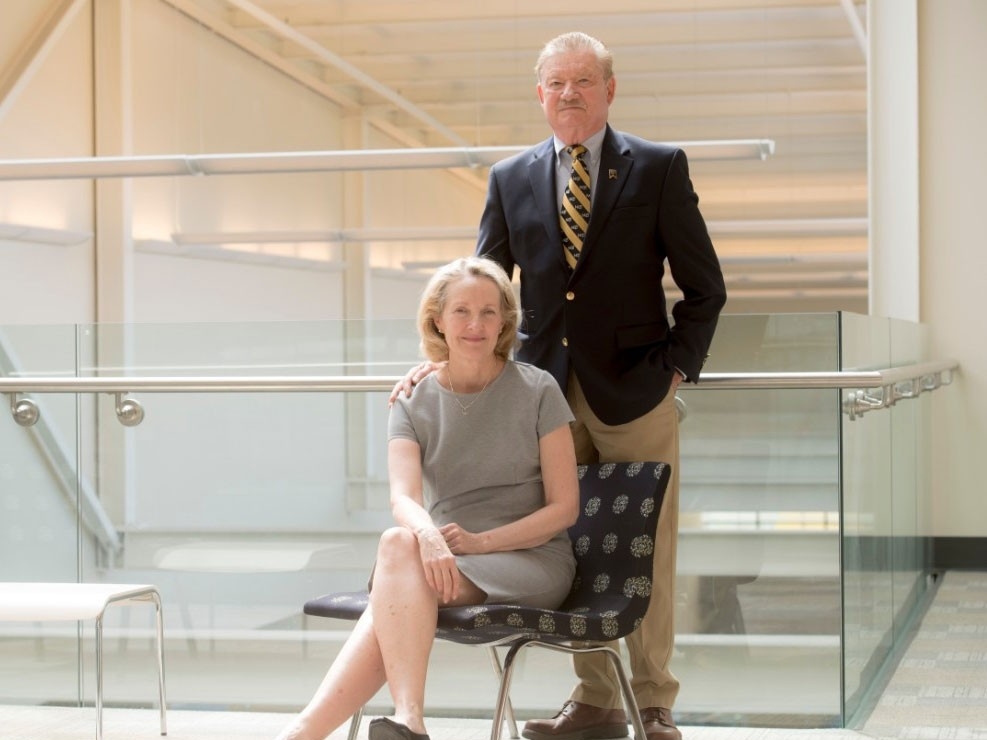 Larry Geismann standing with wife