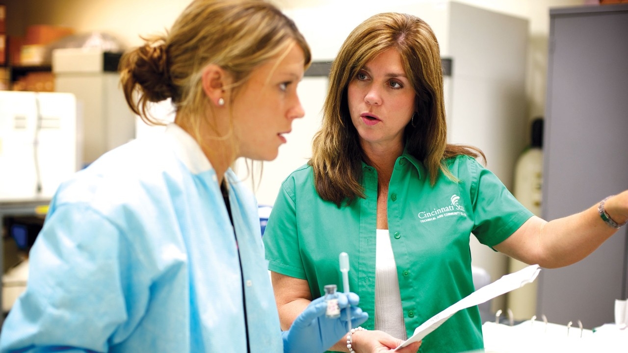 A student and instructor look at scientific data