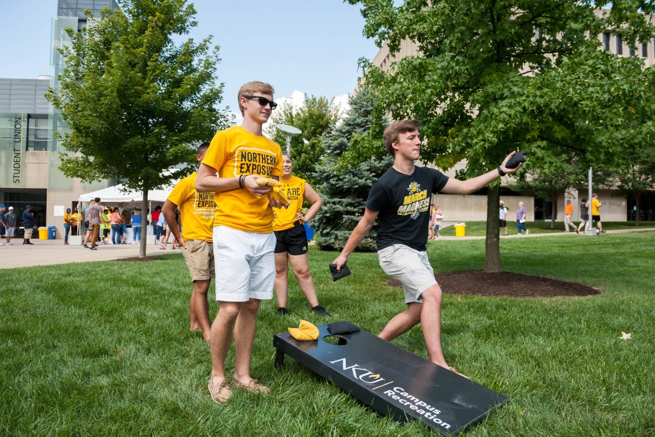 students playing cornhole